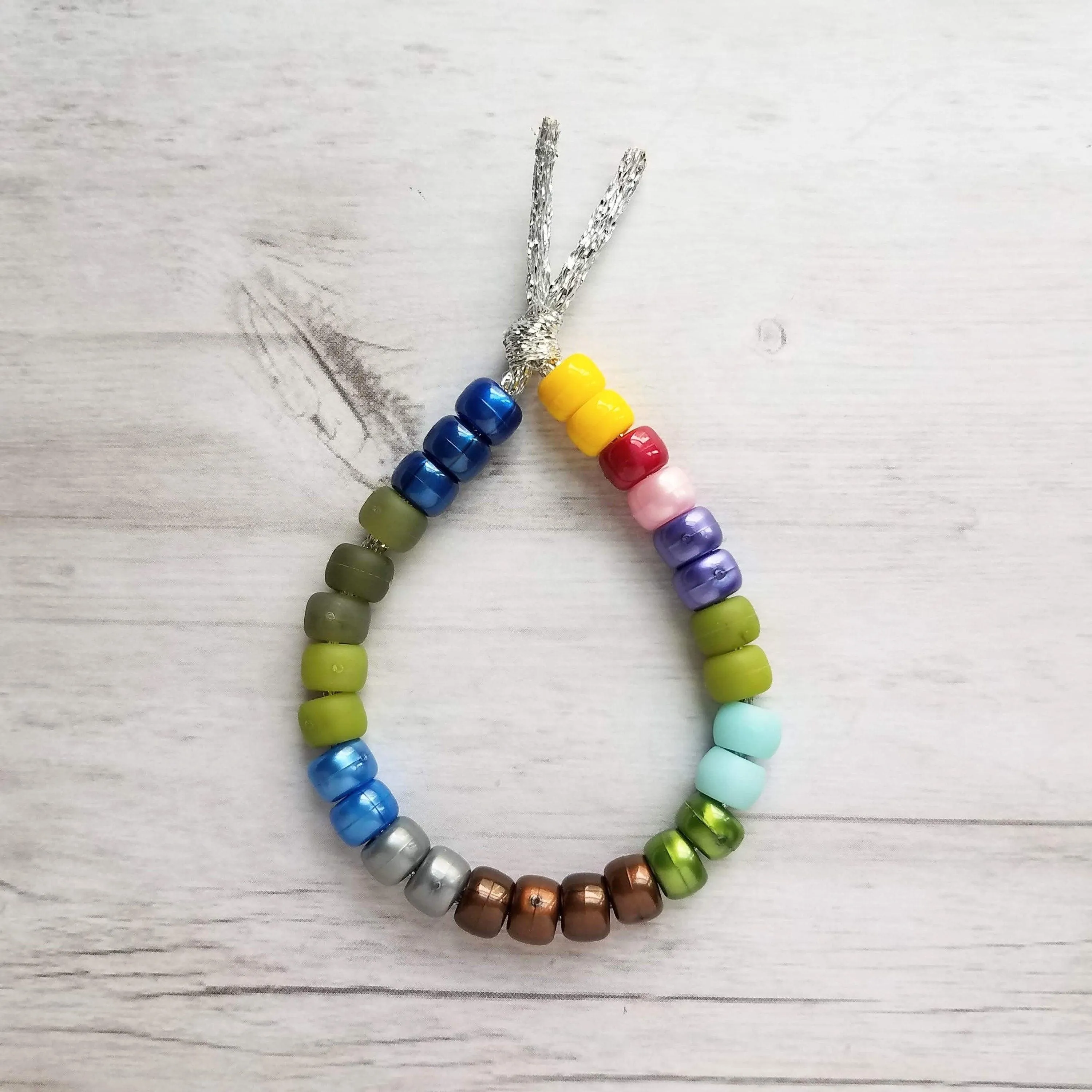 Crow Bead Bracelet, designer style bracelet, large bead tie on cord, big bead bracelet, ugly color bracelet, pony roller beads, chunky beads