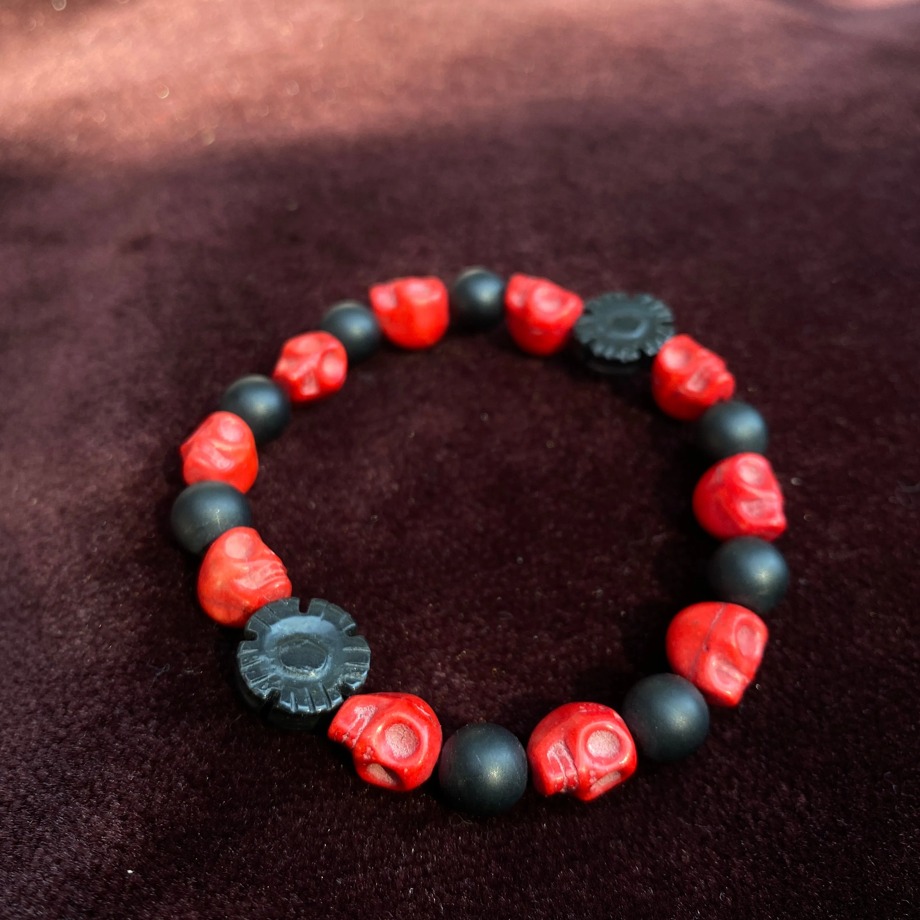 Red Skull carved howlite with matte Onyx Gemstone stretch bracelet