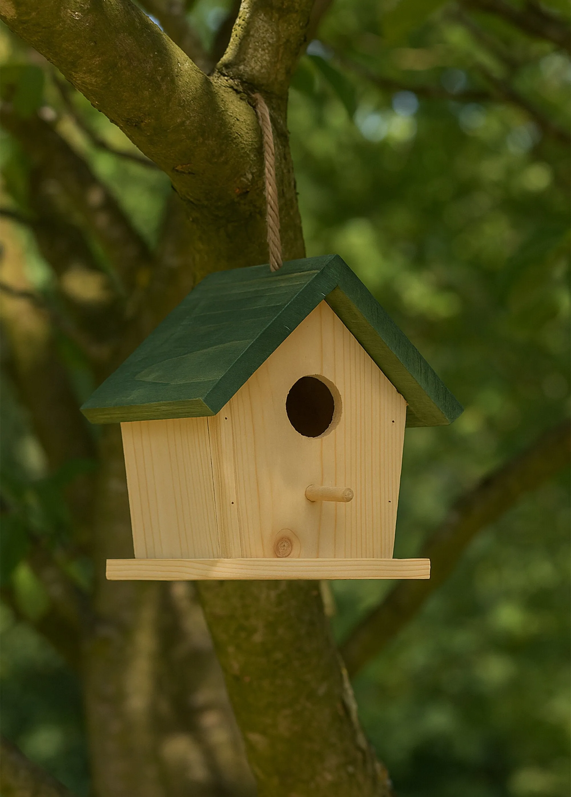 Wooden and rope birdhouse